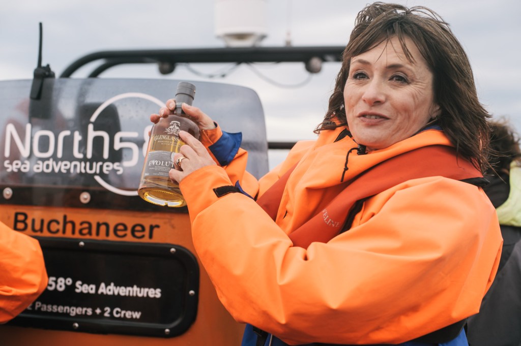 Glenglassaugh - Rachel Barrie with Glenglassaugh Evolution during boat tour along Portsoy coast